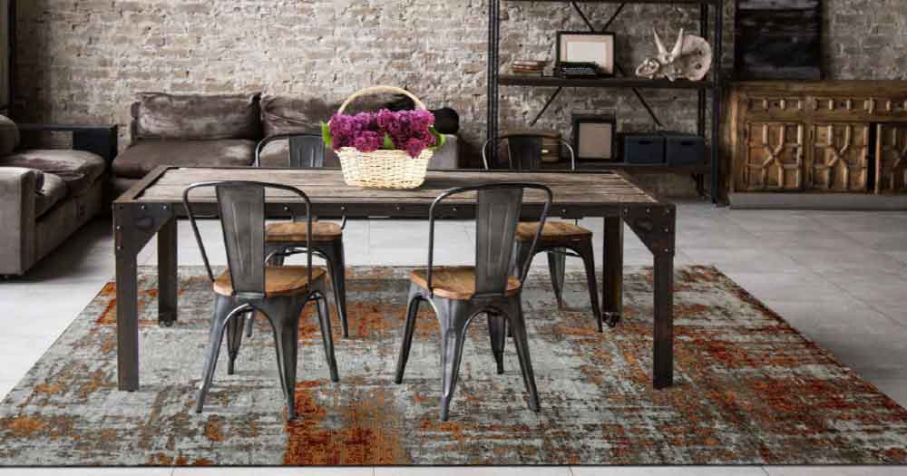 Ein grauer Teppich im Raum unter einem Esstisch aus der Barta Collection